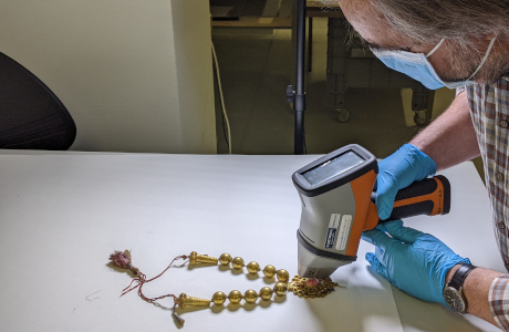 man analysing the necklace with a machine