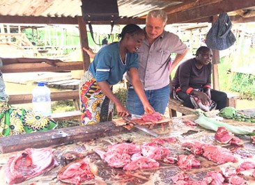 Séphora, a bushmeat market seller in Ouesso, Republic of Congo, explaining her work to Trefon