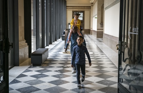 family in the entrance of the museum